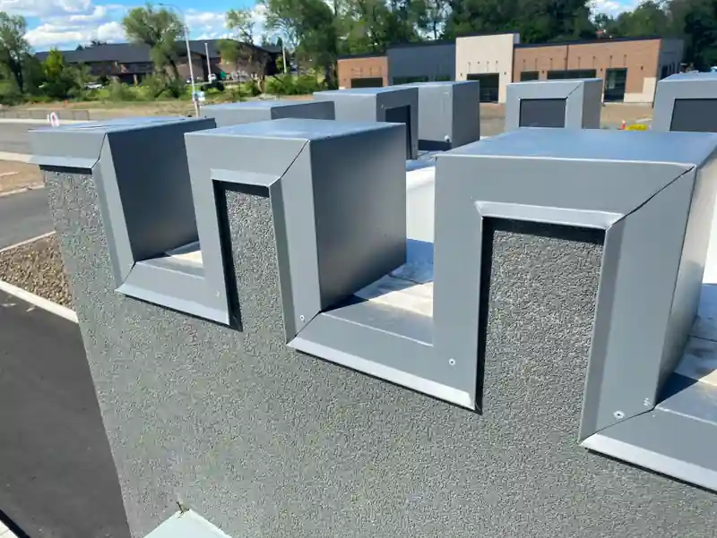 Close view of fabricated metal parapet caps on a commercial building
