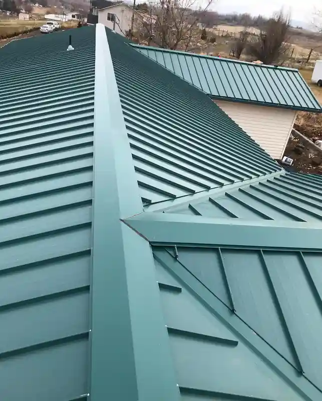 Green standing seam at a hip and valley